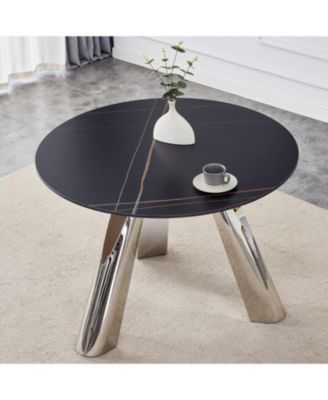 Streamdale A 42-inch burn stone round table with stainless steel legs can accommodate 4 or 6 diners