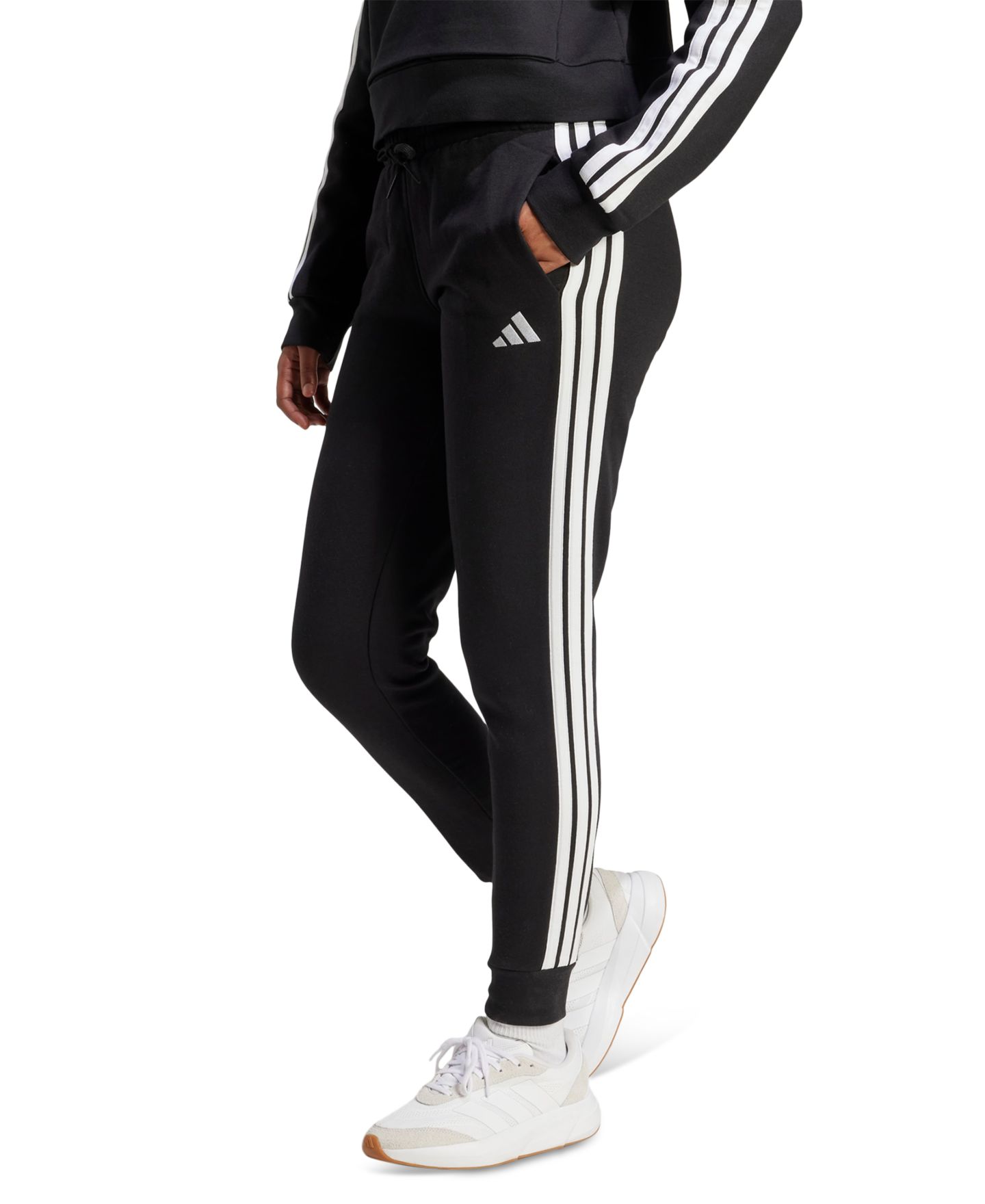 Женские брюки adidas Essentials Three Stripes Fleece Slim, цвет: Чёрный / Белый — фото 1