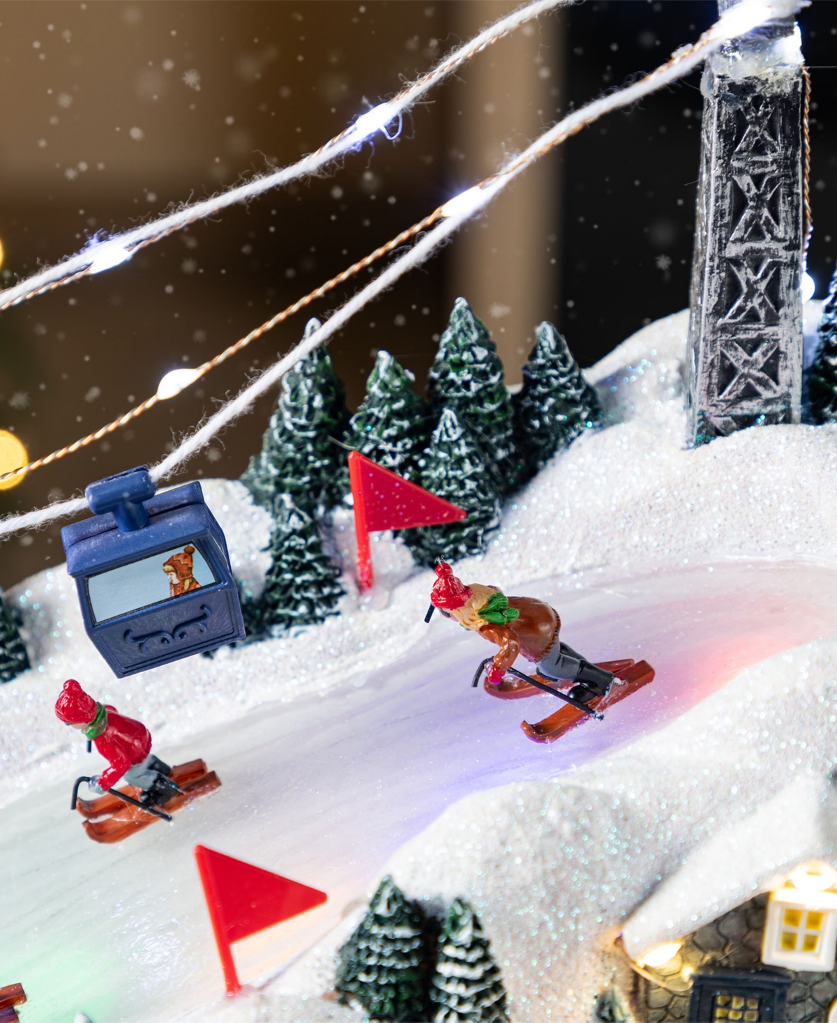 Glitzhome 16" Christmas Oversized Resin Lighted Musical Skiing Village In Multi