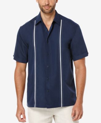 a man wearing a blue button-down shirt with two white stripes