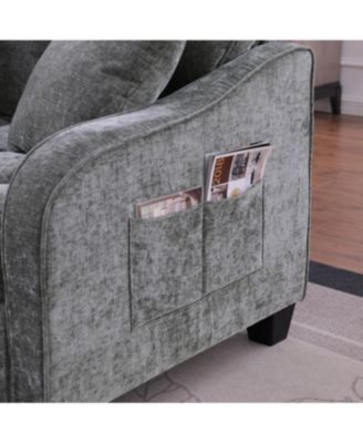 Grey two-seater sofa with chaise, storage footrest, and two pillows