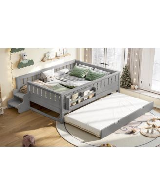 Full bed with bookshelves, staircase, safety rails, trundle