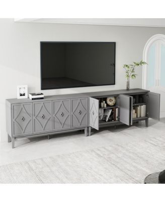 Vintage 4-door cabinet with hand-carved geometric doors and adjustable shelves