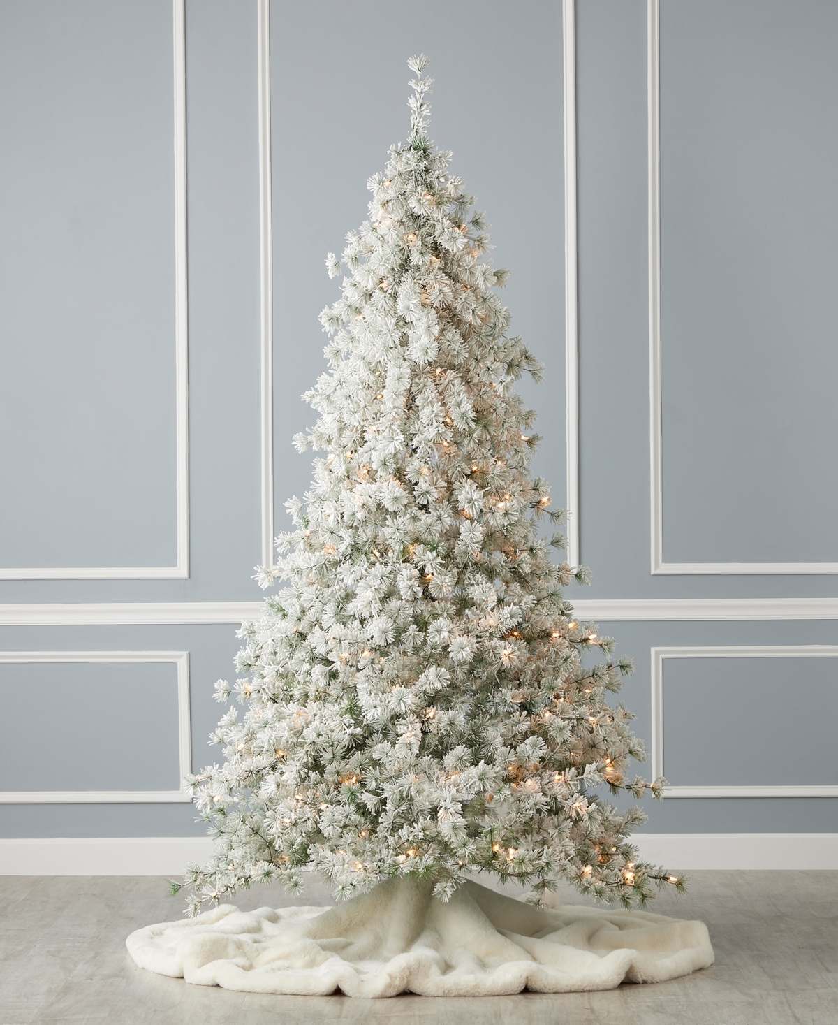 Shop Seasonal Flocked Winter Fir 9' Pre-lit Flocked Hard Needle Tree With Metal Stand 1198 Tips, 400 Warm Led, Rem In White