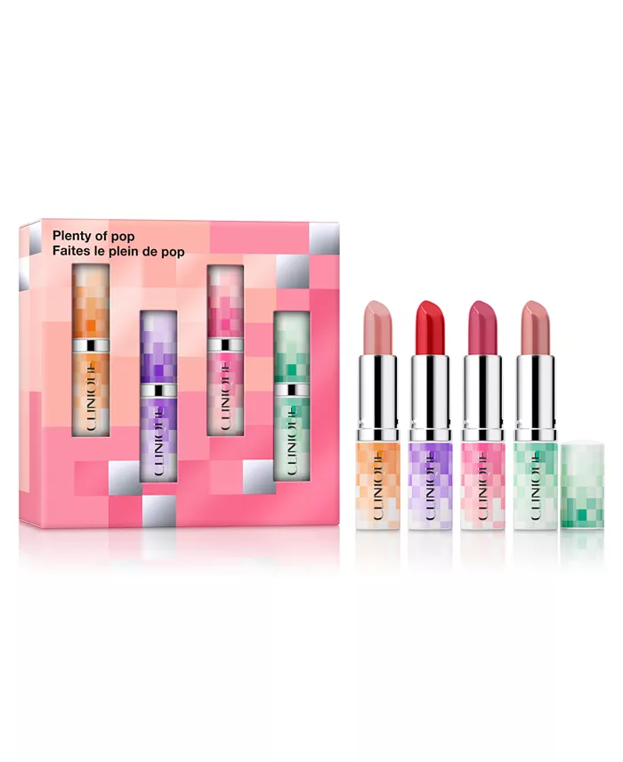 A pink gift box with four open lipsticks in front of it