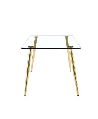 Table and chair set.Modern rectangular glass dining table with tempered glass countertop and golden metal legs, paired with multiple transparent high-quality PET dining chairs with golden legs.