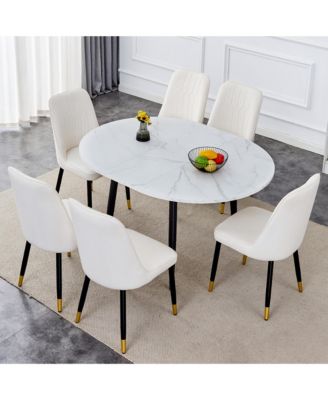 Table and chair set.Modern Extendable MDF Dining Table.The table has a telescopic design, suitable for gatherings of different size.Paired with 6 chairs with PU cushions and black metal legs.