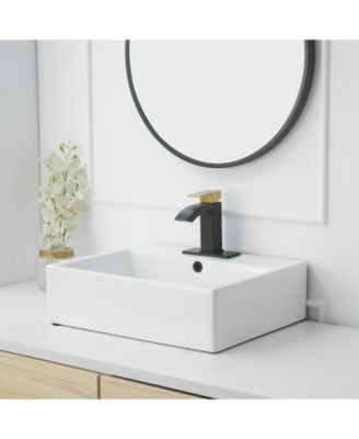 Waterfall Single Hole Single-Handle Low-Arc Bathroom Sink Faucet With Pop-up Drain Assembly In Gold Black