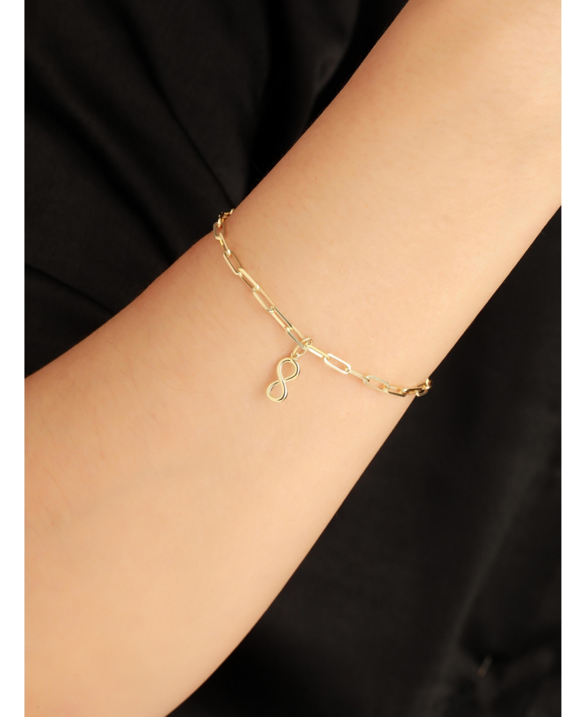 Devata Infinity Charm with Paperclip Chain Bracelet in 14K Gold, 7 in, approx. 2.6 grams.