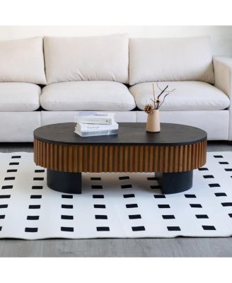 Elliptical coffee table with storage