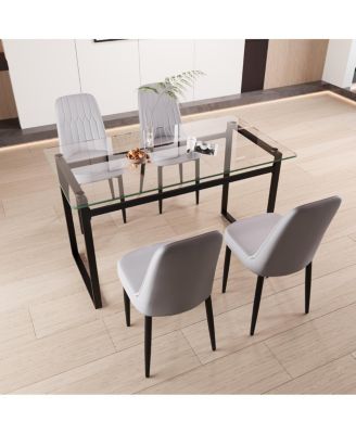 51" 4-person glass dining table set with Black metal legs & cushioned chairs.