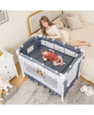 Baby 4-in-1 Convertible Bassinet with Changing Table, Music Box and Wheels