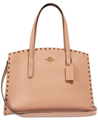 coach charlie carryall rivets