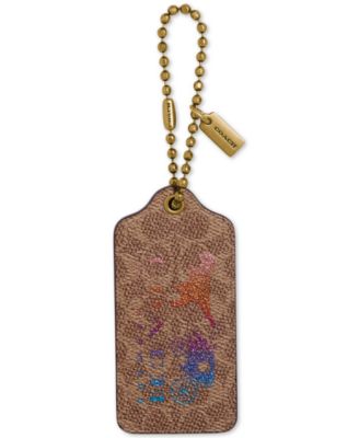 coach gold metal hang tag