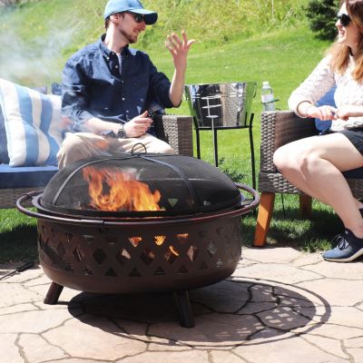 Outdoor Camping or Backyard Crossweave Cut Out Fire Pit with Spark Screen, Log Poker, and Metal Wood Grate - Bronze