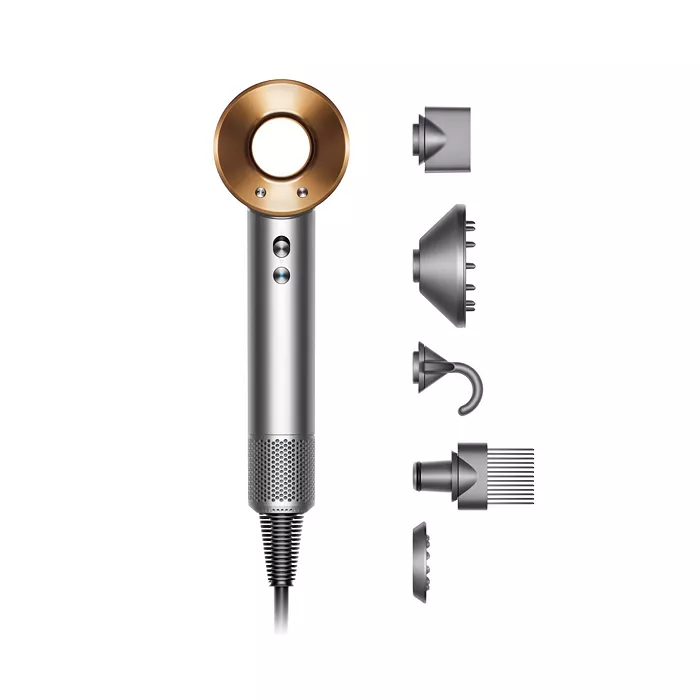 A silver and orange hair dryer next to five accessories
