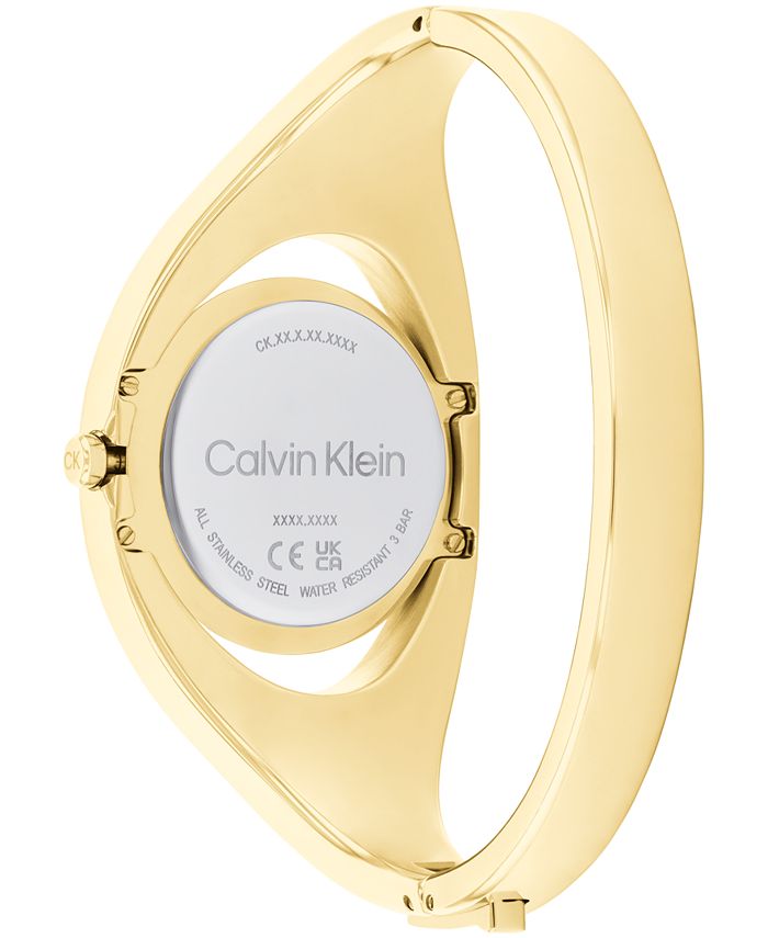 Calvin Klein Women's Two Hand Gold-Tone Stainless Steel Bangle Bracelet ...
