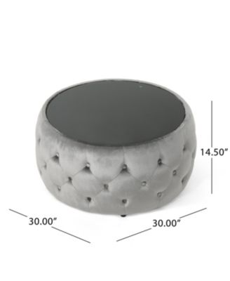 velvet design with diamond tufting and a tempered glass top is offered as a modern glam ottoman