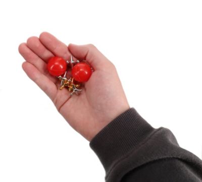Old-Fashioned Metal Jacks in a Wooden Box