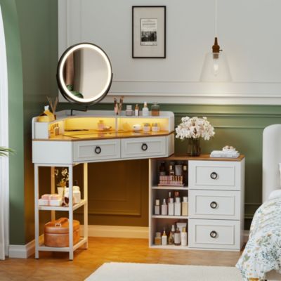Corner vanity desk with mirror, three-color LED lights, and charging station.