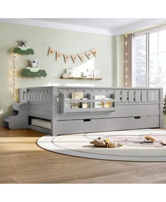 Full bed with bookshelves, staircase, safety rails, trundle