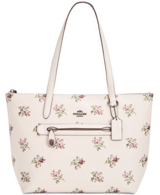 white coach purse with flowers