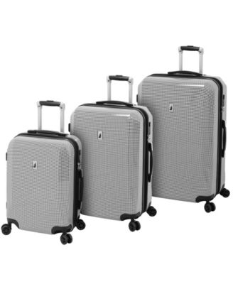 white hardside luggage