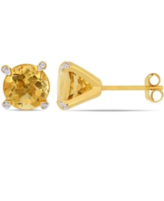 Gemstone and Diamond Accent Stud Earrings in 10k White Gold. Available in Blue Topaz (4-3/4 ct.t.w.), Citrine (3 5/8 ct.t.w), Garnet (4 ct.t.w.), Amethyst (3 ct. t.w.) & Prasiolite (3 1/2 ct.t.w.)
