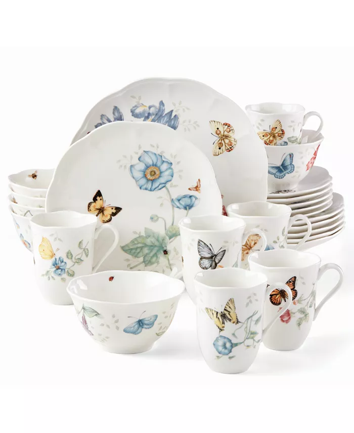 A dinnerware set with butterflies on it