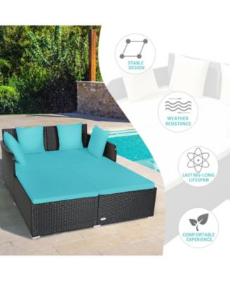 Spacious Outdoor Rattan Daybed with Upholstered Cushions and Pillows