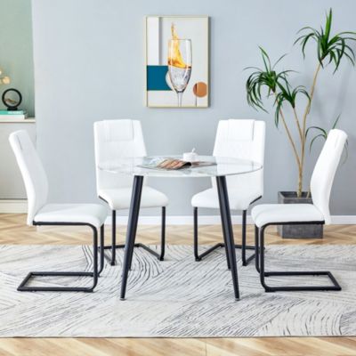 Table and chair set. Large modern white imitation marble patterned round table with black metal legs. Nice minimalism, comfortable seats and black metal legs.