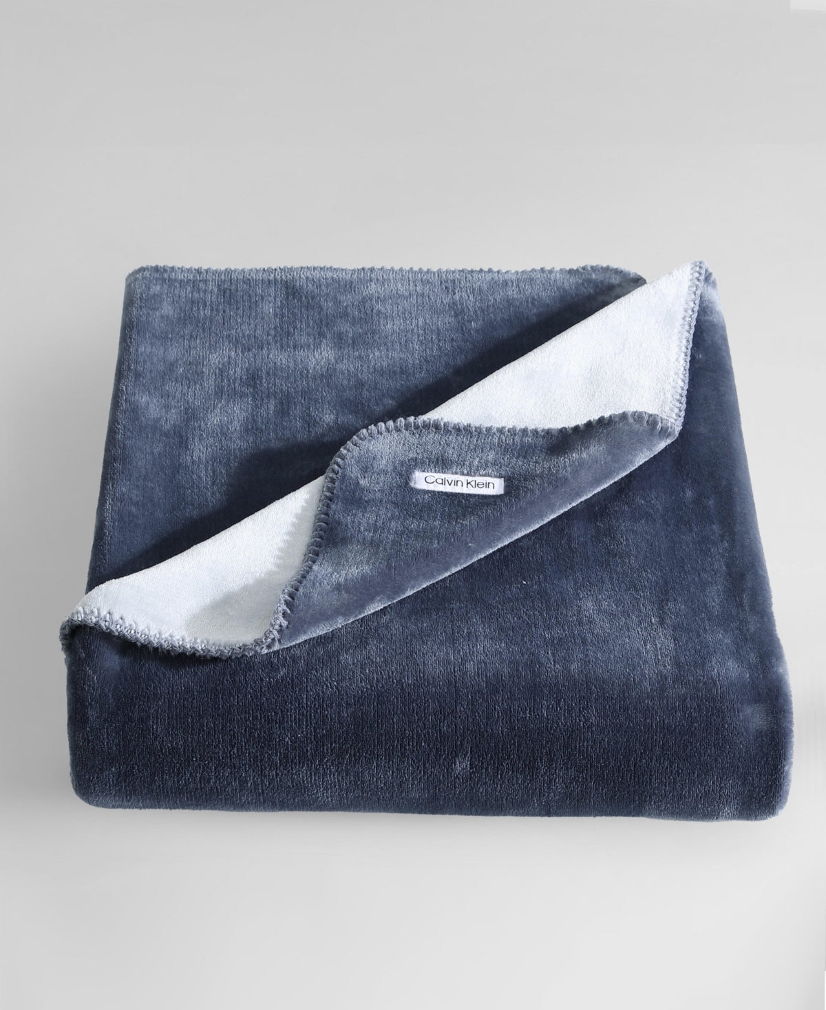 Calvin Klein Modern Solid Reversible Throw Blanket, 70" X 50" In Slate Blue,dawn Blue