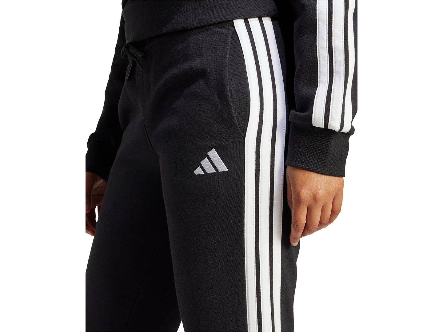 Женские брюки adidas Essentials Three Stripes Fleece Slim, цвет: Чёрный / Белый — фото 4