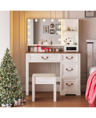 Vanity desk for bedroom with lights, drawers, shelves, stool, and mirror.