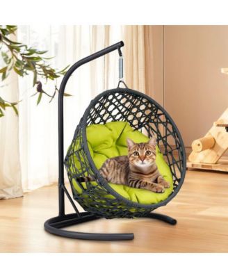 This rattan cat swing bed with cushion and stand provides a cozy swinging space for cats and small pets offering comfort and relaxation indoors