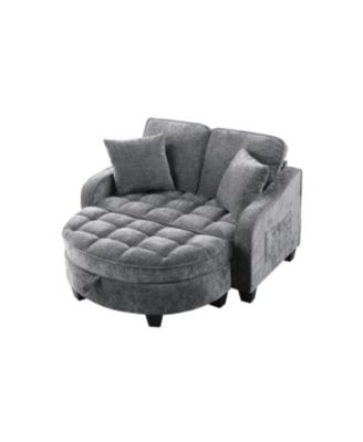 Grey two-seater sofa with chaise, storage footrest, and two pillows