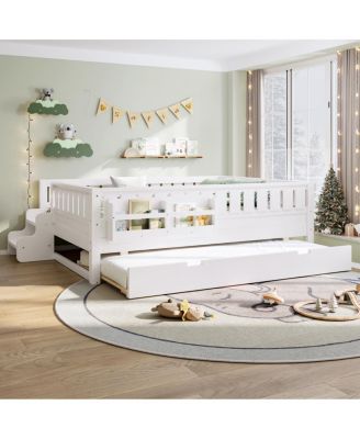 Full bed with bookshelves, staircase, safety rails, and trundle