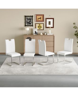 Set of 4 PU bow-shaped chairs for minimalist/contemporary homes.