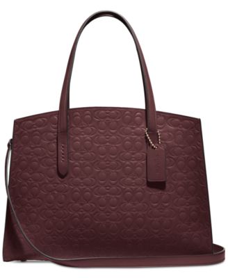 oxblood coach purse