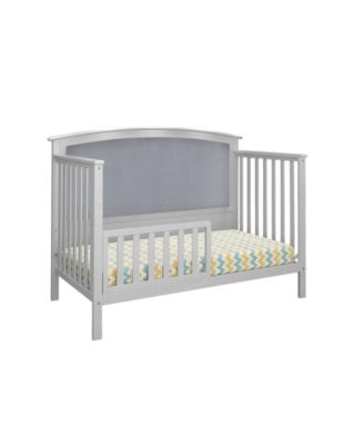 white upholstered crib