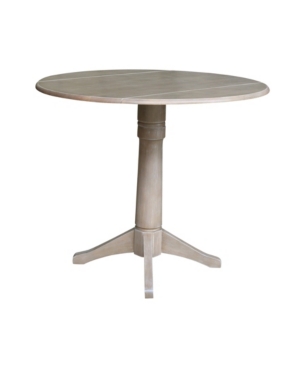 INTERNATIONAL CONCEPTS 42" ROUND DUAL DROP LEAF PEDESTAL TABLE