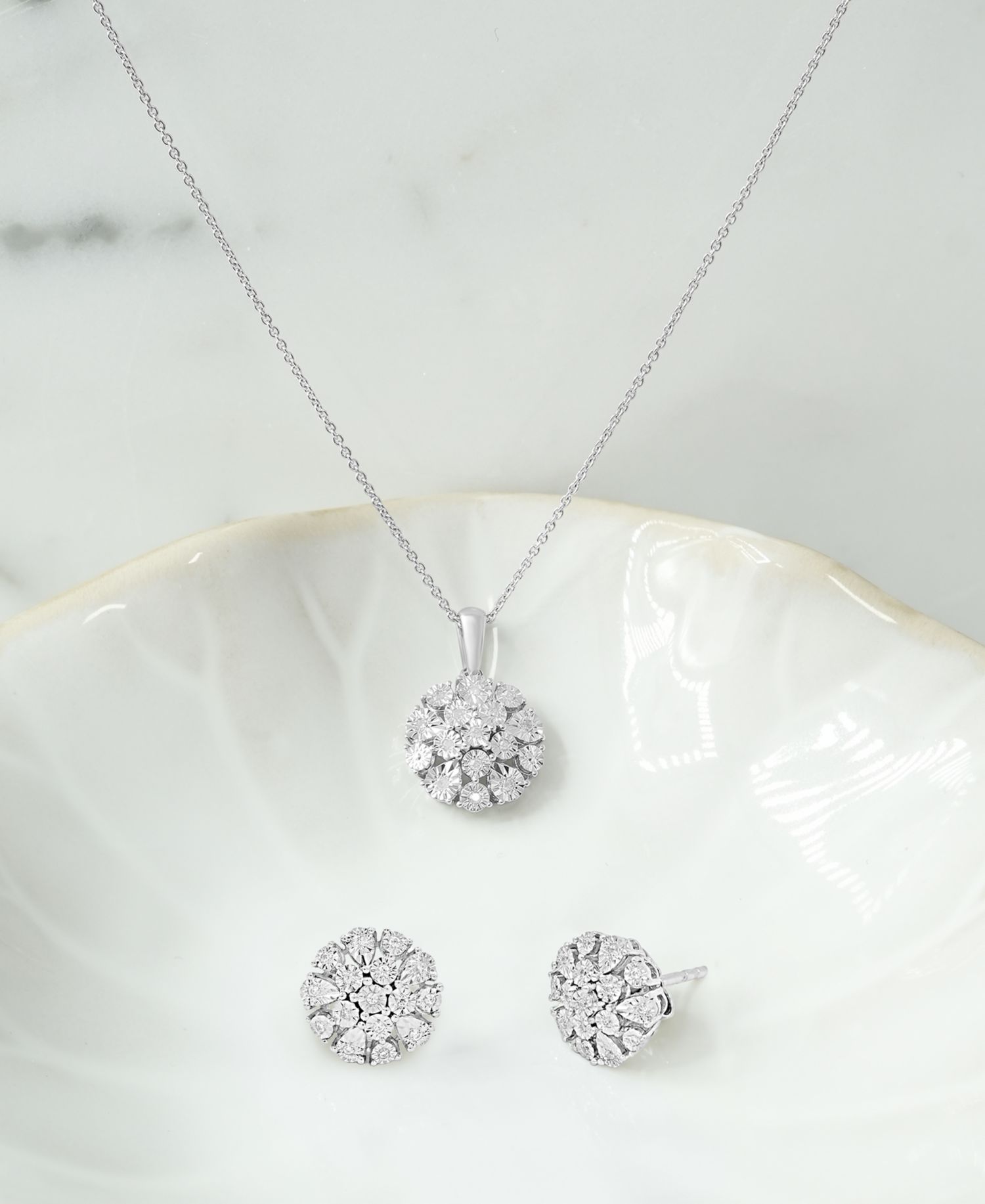 Diamond Flower Burst Stud Earrings (1/10 ct. t.w.) in Sterling Silver