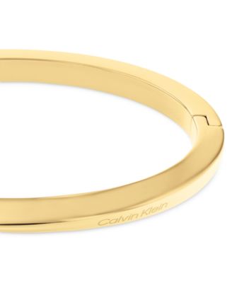 Золотистый браслет Calvin Klein из нержавеющей стали Twist Bangle 24890₽