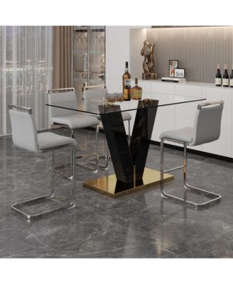 Table and chair set. A rectangular glass dining table with a 0.4-inch tempered glass tabletop and MDF board V-shaped bracket, paired with chairs consisting of PU seat cushions and silver metal legs.