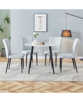 Table and chair set. Large modern white imitation marble patterned round table with black metal legs. Nice minimalism, comfortable seats and black metal legs.