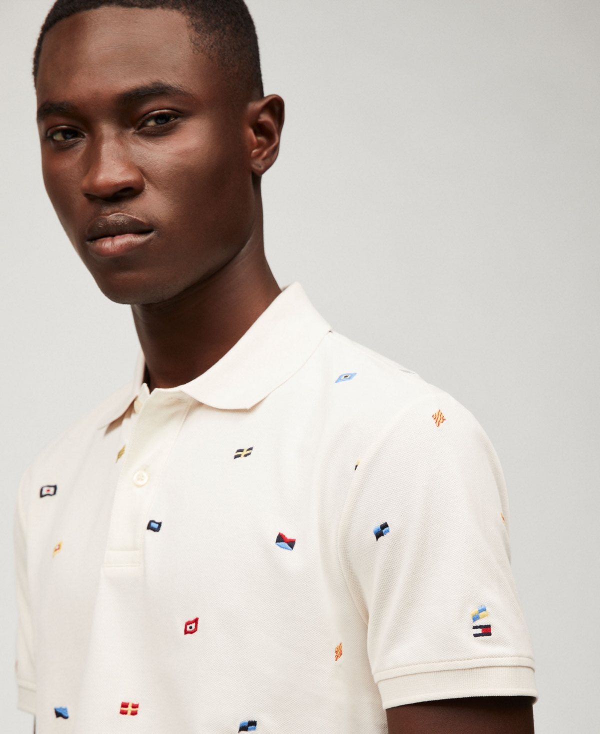 Tommy Hilfiger Men's Regular Fit Allover Flag Polo Shirt In Ivory Petal