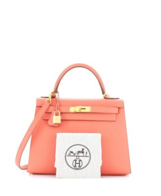 Бывшая в употреблении сумочка HERMES Kelly 28 розового цвета с золотой фурнитурой