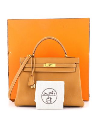 Бывшая в употреблении сумка Hermes Kelly 32 коричневого цвета в Арденнах с золотой фурнитурой
