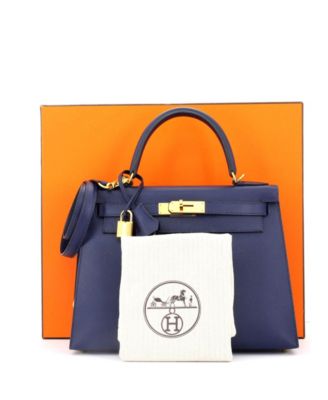 Бывшая в употреблении сумка Hermes Kelly 28 синего цвета с золотой фурнитурой