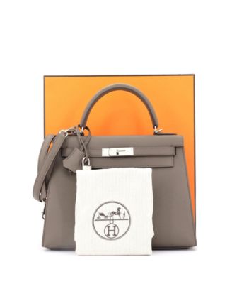 Бывшая в употреблении сумка Hermes Kelly 28 серого цвета с палладиевой фурнитурой